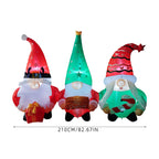 Garden Sanctuary Christmas inflatable gnome trio with LED lights, festive outdoor holiday decoration featuring cheerful gnome figures.