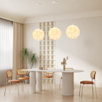 Creative 3D printed moon pendant light by DEMOLIGHTS hanging from ceiling, eco-friendly lunar globe chandelier for bedroom decor.