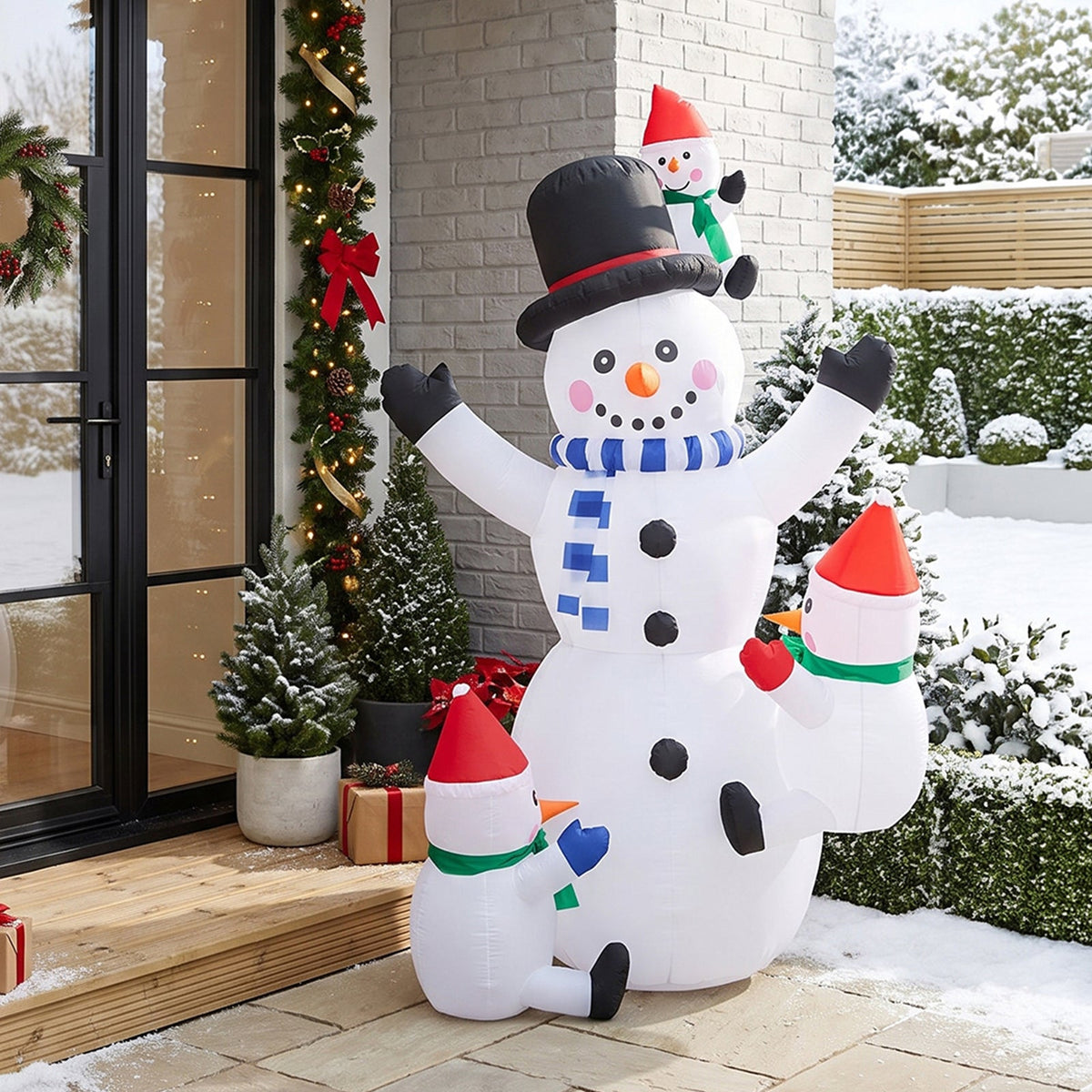 Garden Sanctuary 2.1m Christmas inflatable snowman family with LED lights, festive outdoor holiday decoration.
