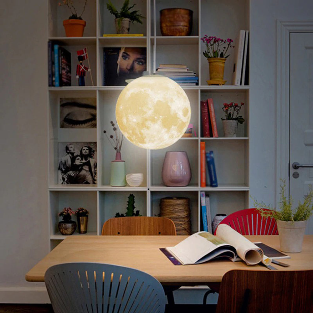 3D printed moon pendant light by DEMOLIGHTS, eco-friendly lunar globe chandelier illuminating a bedroom ceiling with soft glow