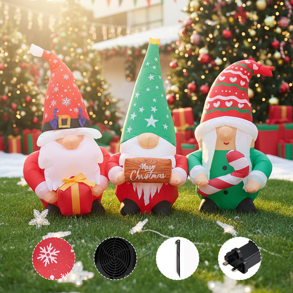 Christmas inflatable gnome trio with LED lights by Garden Sanctuary, showing colorful gnomes decorated for holiday outdoor display.