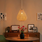 E27 rattan-woven ceiling pendant light by Garden Sanctuary with a warm, natural woven rattan shade hanging from the ceiling.