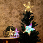 Christmas LED star tree topper by Garden Sanctuary, glowing white star with festive lights for holiday decoration.