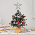 Mini pre-lit artificial Christmas tree with star topper from Garden Sanctuary, perfect for tabletop holiday decor.