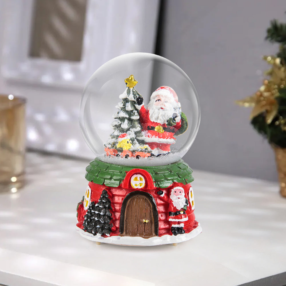 Garden Sanctuary Santa Claus snow ball gift music box Christmas glass ornament, featuring a festive Santa figure inside a snow globe.