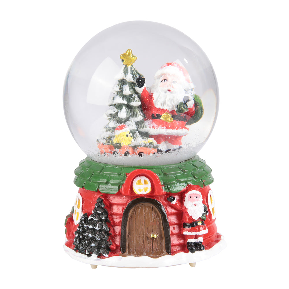Garden Sanctuary Santa Claus snow globe music box Christmas glass ornament with festive holiday scene and snow effect.