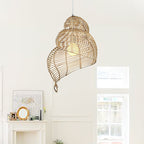 Handmade conch wicker pendant light by DEMOLIGHTS with rattan and bamboo lampshade, showcasing intricate woven design.