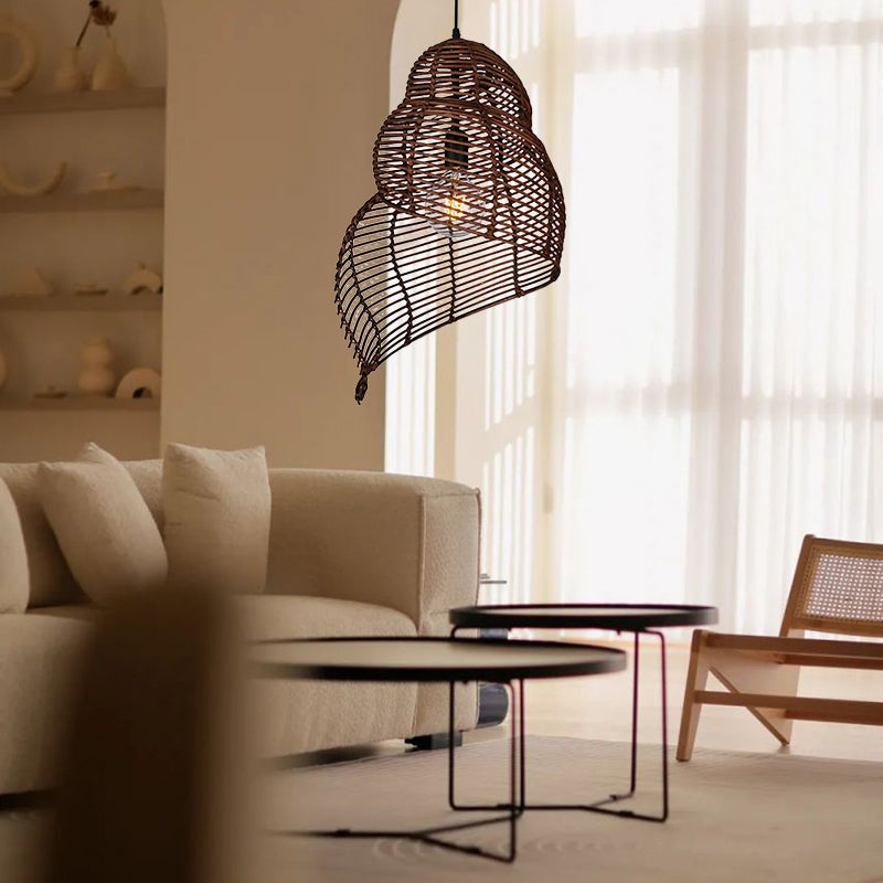 Handmade conch wicker pendant light with rattan and bamboo lampshade by DEMOLIGHTS, showcasing a natural woven design for warm lighting.
