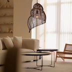 Handmade conch wicker pendant light with rattan and bamboo lampshade by DEMOLIGHTS, showcasing a natural woven design for warm lighting.