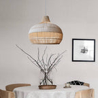 Handwoven rattan pendant light by DEMOLIGHTS hanging above a kitchen island, featuring a boho ceiling lamp design for stylish illumination.
