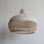 Handwoven rattan pendant light by DEMOLIGHTS hanging over a kitchen island, featuring a boho ceiling lamp design.