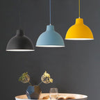 Colorful iron pendant light fixture from DEMOLIGHTS with vibrant, multicolored design hanging from a ceiling.