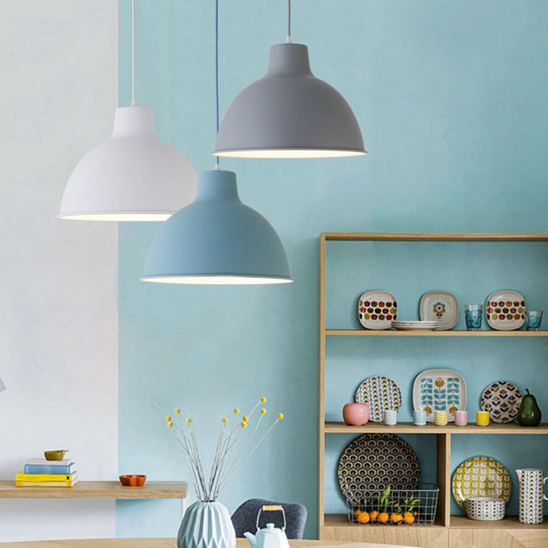 Colorful iron pendant light fixture by DEMOLIGHTS hanging from ceiling with vibrant, multicolored design and metal finish.