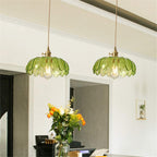 Brass and glass dome pendant ceiling light by DEMOLIGHTS, featuring a sleek design with a glass shade and brass finish.