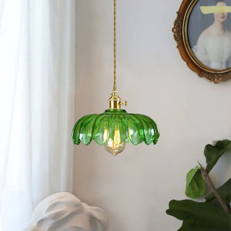 Brass and glass dome pendant light by DEMOLIGHTS, ceiling lighting fixture with sleek glass shade and brass accents.