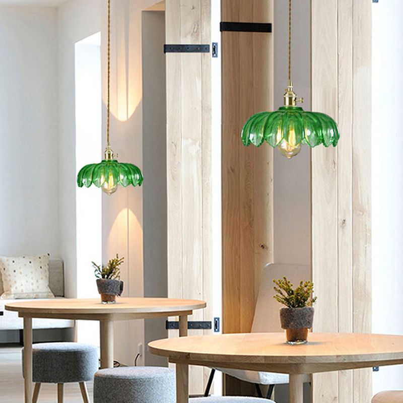 Brass and glass dome ceiling pendant light by DEMOLIGHTS, showcasing a stylish brass fixture with a clear glass dome cover.