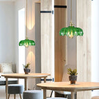 Brass and glass dome ceiling pendant light by DEMOLIGHTS, showcasing a stylish brass fixture with a clear glass dome cover.