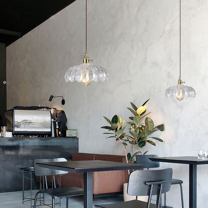 Brass and glass dome ceiling pendant light by DEMOLIGHTS with a modern design, featuring a clear glass shade and brass finish.