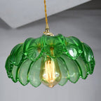 Brass and glass dome pendant light by DEMOLIGHTS hanging from ceiling, modern ceiling lighting fixture with sleek design
