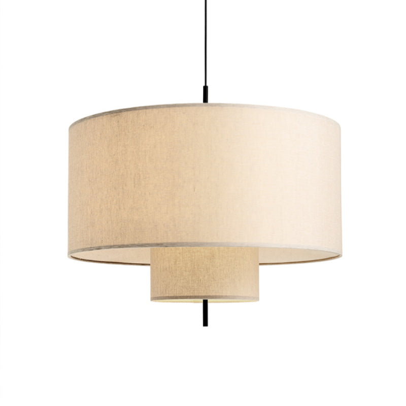 Modern fabric shade pendant light by Demolights with a sleek cylinder shape hanging from a ceiling mount.