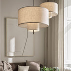 Modern fabric shade pendant light by Demolights featuring a sleek cylindrical design for contemporary interior lighting.