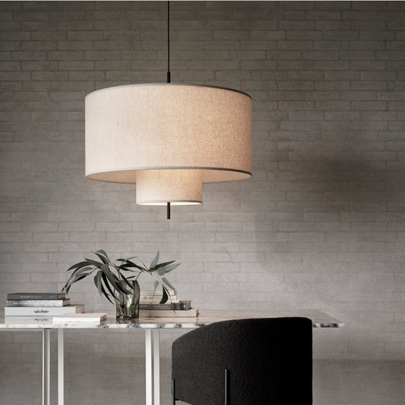 Modern fabric shade pendant light by Demolights featuring a sleek cylinder shape and contemporary design.