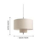 Modern fabric shade pendant light by Demolights with cylindrical shape, hanging from ceiling with warm lighting.