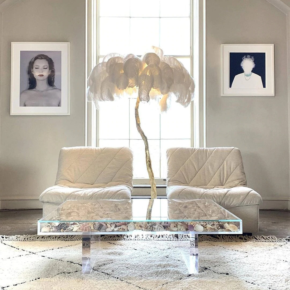 Luxury DEMOLIGHTS ostrich feather brass floor lamp with tall, elegant design and intricate feather details in a modern living space.