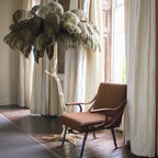 Luxury DEMOLIGHTS ostrich feather brass floor lamp with a tall, elegant design and intricate feather detailing.