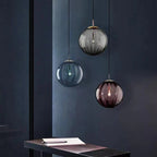 Clear glass ball pendant lamp from DEMOLIGHTS, hanging pendant light fixture with a sleek spherical design.