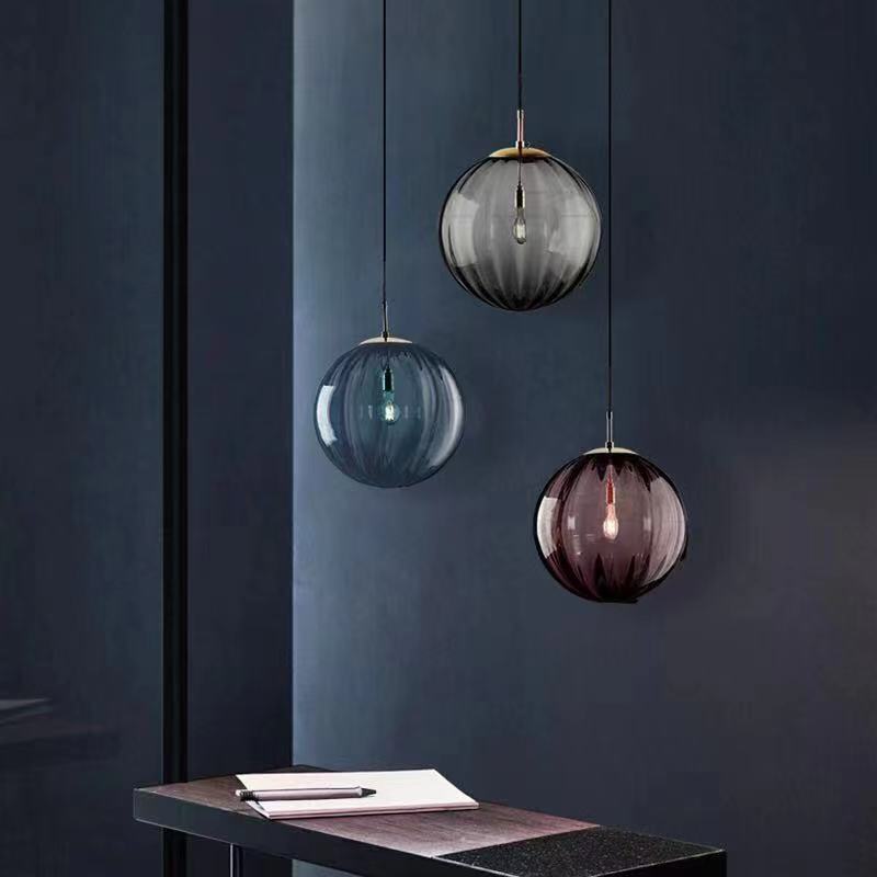 Clear glass ball pendant lamp from DEMOLIGHTS, hanging pendant light fixture with a sleek spherical design.