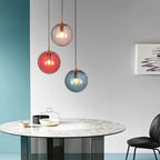 Clear glass ball pendant lamp by DEMOLIGHTS, hanging pendant light with a sleek, spherical glass design for modern interiors.