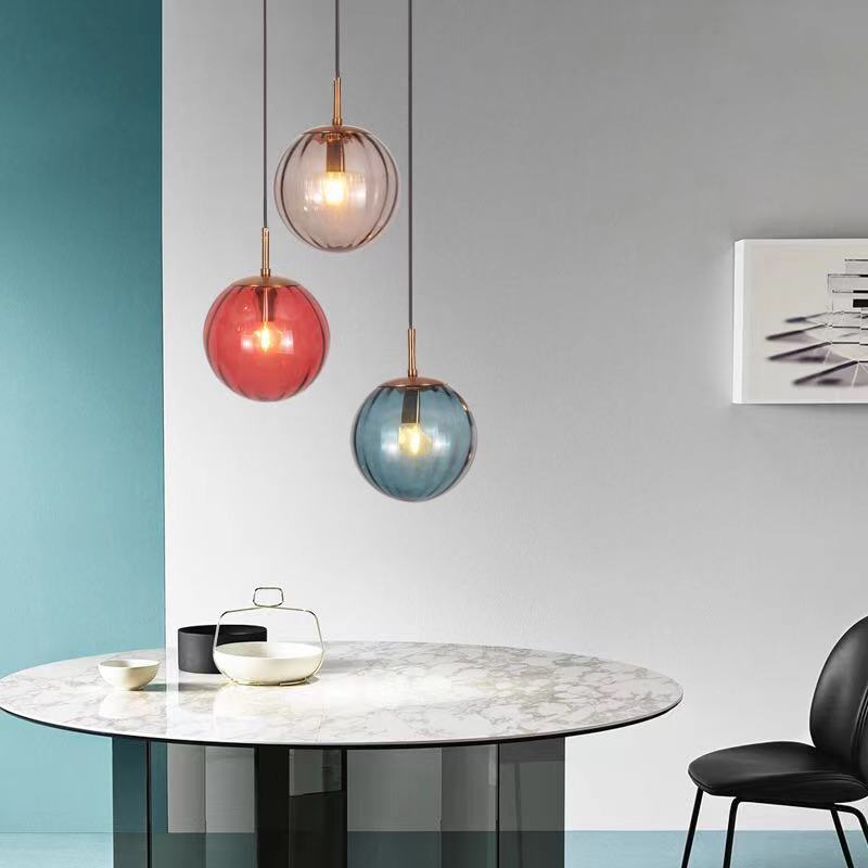 Clear glass ball pendant lamp by DEMOLIGHTS, hanging pendant light with a sleek, spherical glass design for modern interiors.
