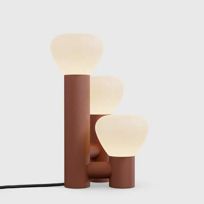 Demolights minimalist 3-light table lamp with red, green, and white shades, modern design for stylish home lighting.
