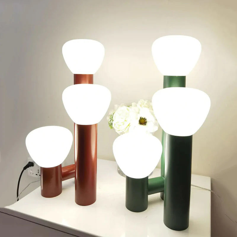 Demolights minimalist 3-light table lamp with red, green, and white shades, modern design for stylish home lighting.
