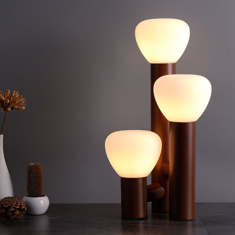 Minimalist DEMOLIGHTS 3-light table lamp with red, green, and white shades, modern design for stylish home lighting.