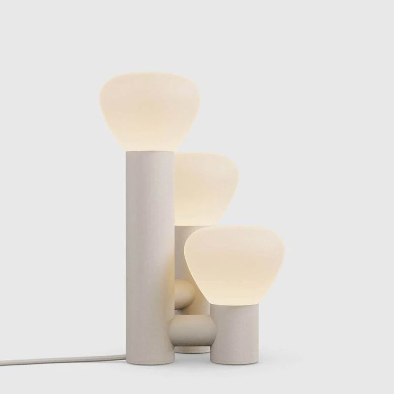 DEMOLIGHTS minimalist 3-light table lamp with red, green, and white shades, modern design for stylish home lighting.