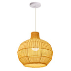 Handwoven rattan pendant light by DEMOLIGHTS hanging above a kitchen island, boho ceiling lamp with intricate woven design.