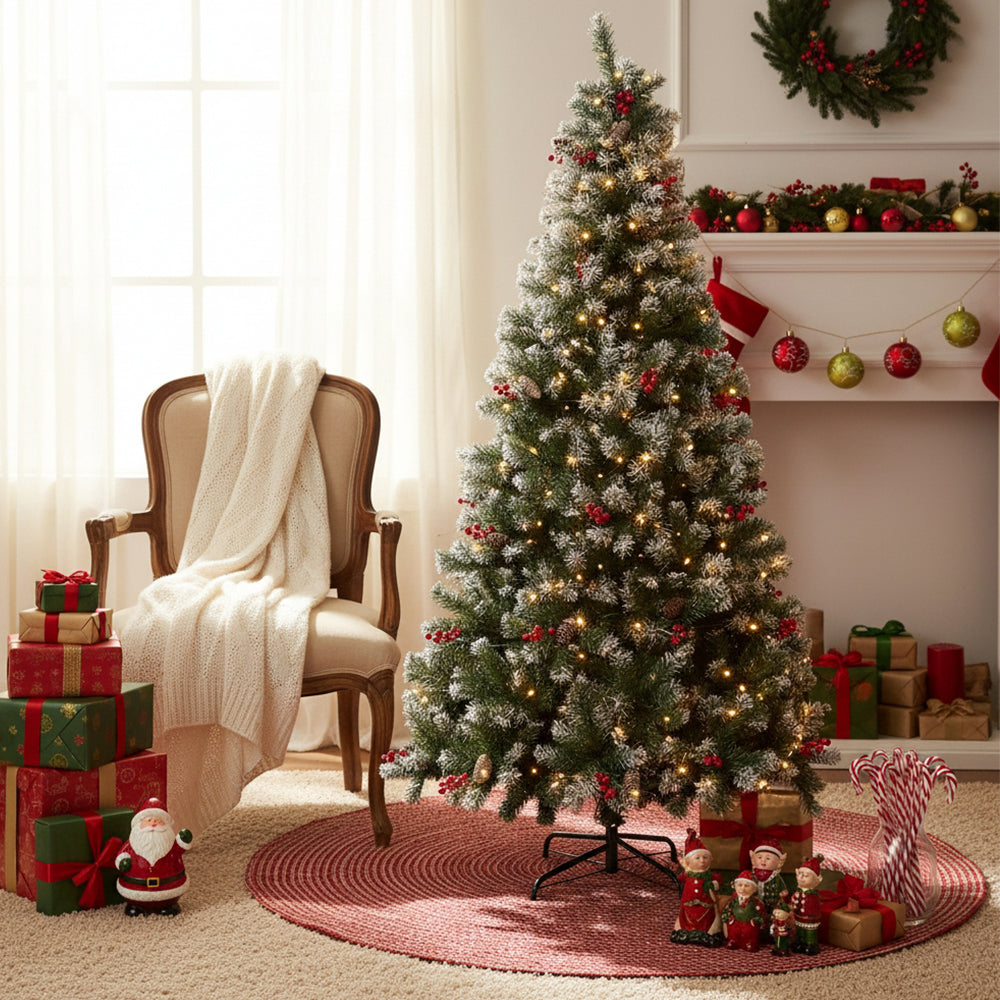 Artificial Christmas tree with metal stand by Garden Sanctuary, full green branches and sturdy base for holiday decorating