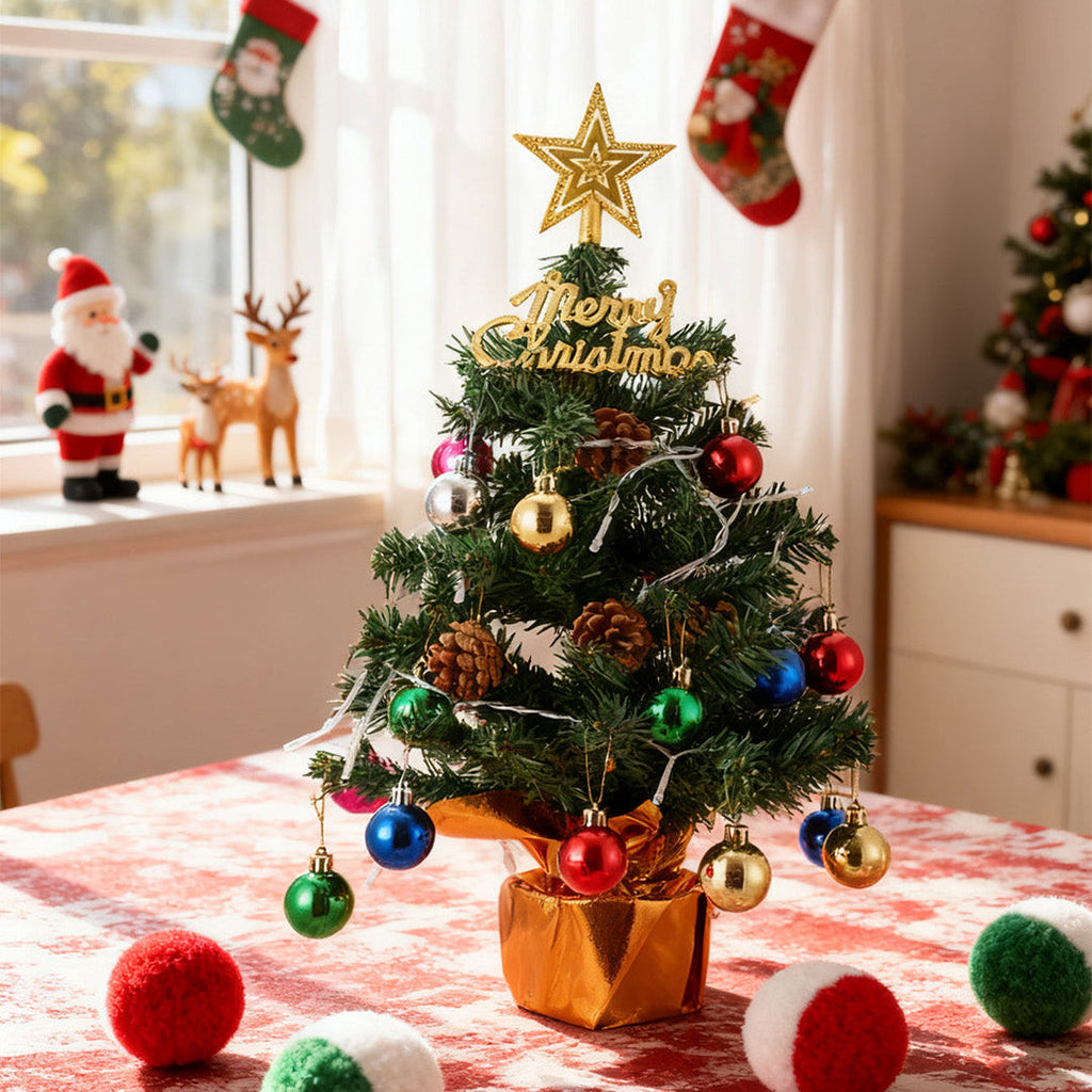 Small Garden Sanctuary tabletop Christmas tree decoration with LED string lights, festive holiday decor for home or office.