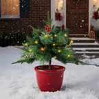 Artificial Christmas tree urn filler decoration with string lights by Garden Sanctuary, featuring festive holiday greenery and glowing lights.