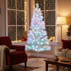 Garden Sanctuary 6ft pre-lit artificial Christmas tree with green branches and foldable metal stand, decorated for holiday display.