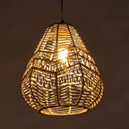 E27 rattan-woven ceiling pendant light by Garden Sanctuary hanging from ceiling, showcasing natural rattan design and warm lighting.