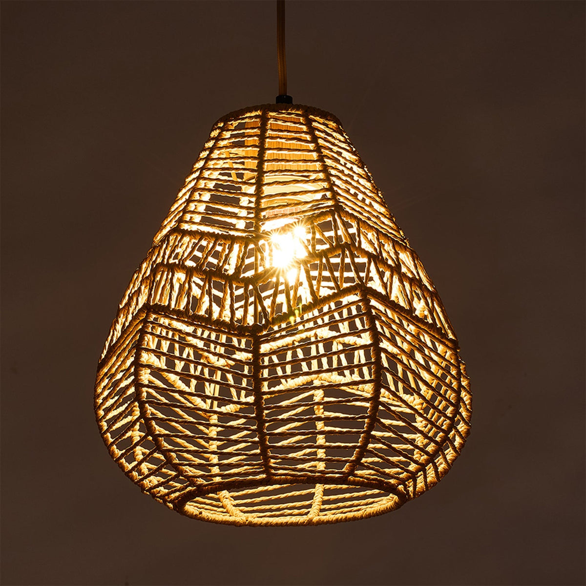 E27 rattan-woven ceiling pendant light by Garden Sanctuary hanging from ceiling, showcasing natural rattan design and warm lighting.