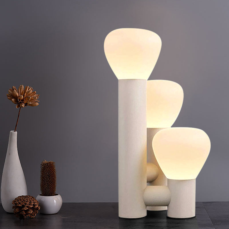 DEMOLIGHTS minimalist 3-light table lamp with green, red, and white shades, featuring a sleek modern design and warm lighting.