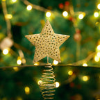 Golden glitter Christmas tree topper from Garden Sanctuary, with star shape and sparkling ornaments for holiday decor.