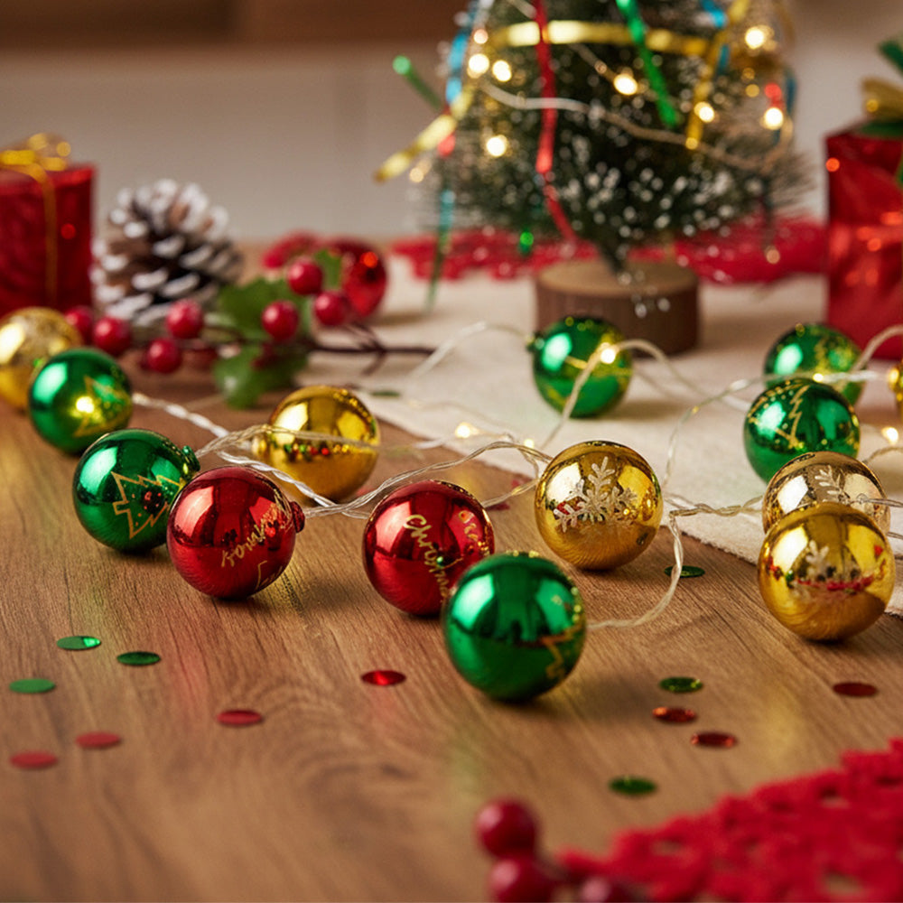 Multicoloured Christmas ball ornament string lights by Garden Sanctuary, battery-powered holiday decoration with festive glow.