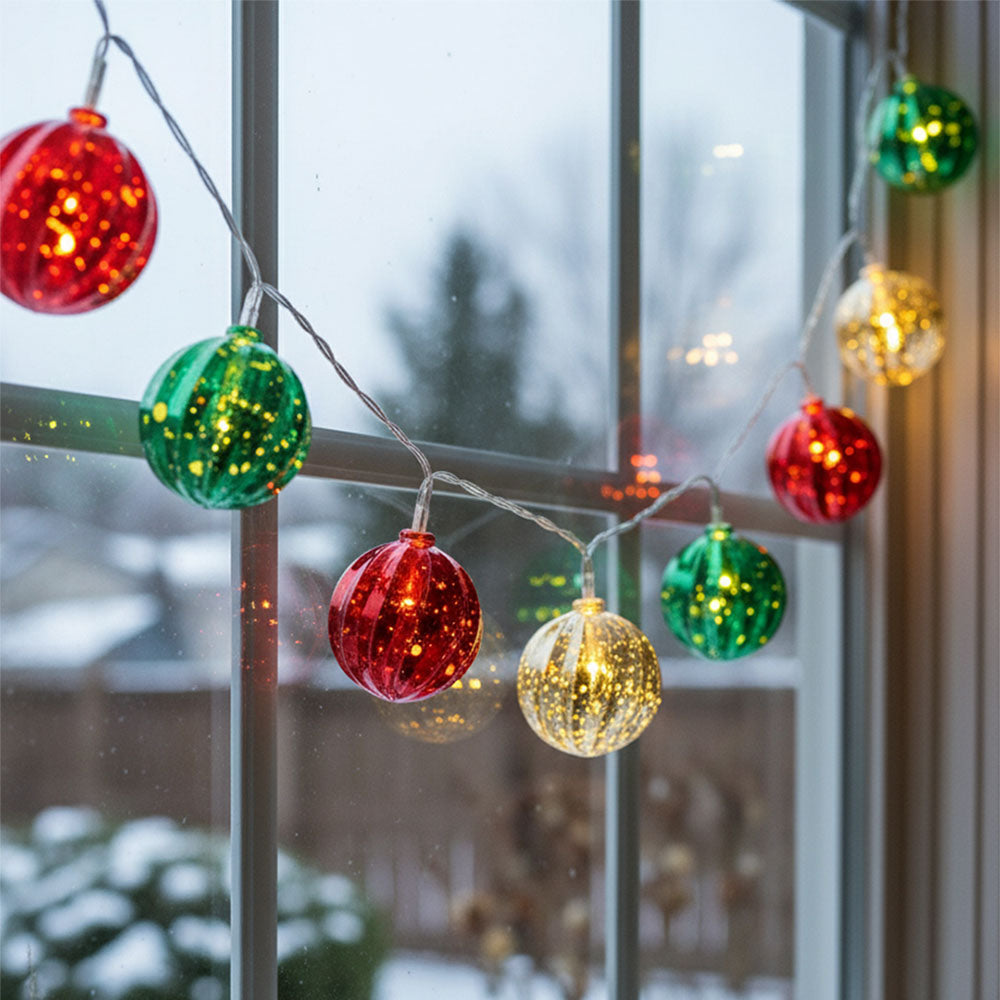 Multicoloured Christmas ball ornament string lights from Garden Sanctuary, battery-powered holiday decorative lights.