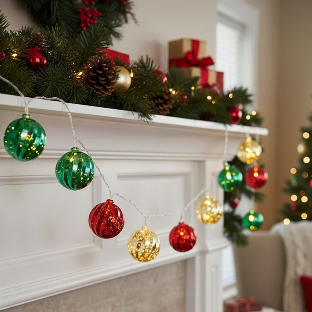 Multicoloured Christmas ball ornament string lights from Garden Sanctuary, battery-powered holiday decoration with festive balls.