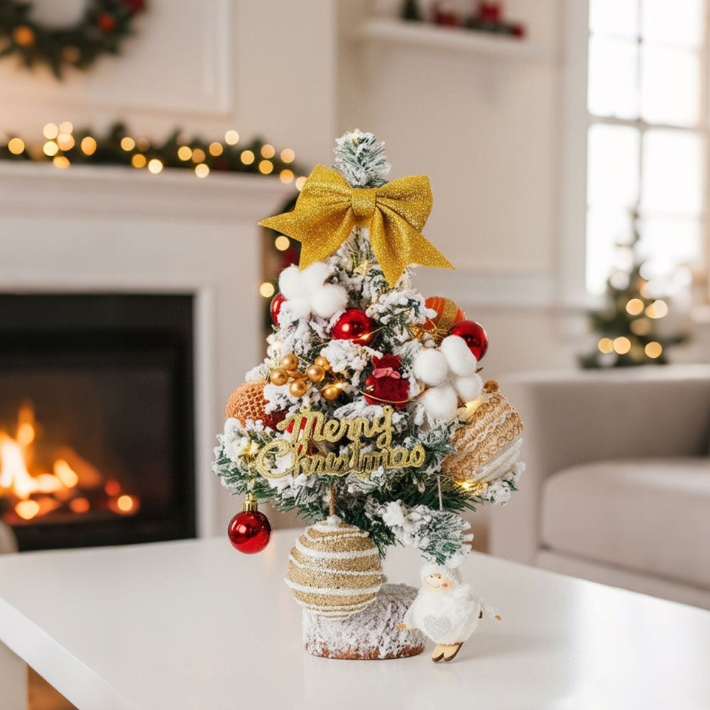 Garden Sanctuary tabletop Christmas tree with LED lights, featuring lush green foliage and festive holiday decorations.